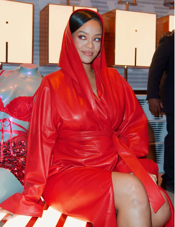 Rihanna posing in her signature color, red.