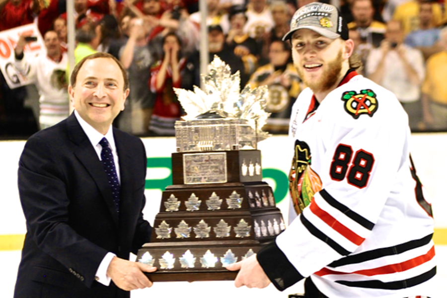 Patrick+Kane+%28right%29+accepting+the+Conn+Smythe+Trophy+from+NHL+commissioner+Gary+Bettman+%28left%29+for+being+Stanley+Cup+Playoffs+MVP+in+2013