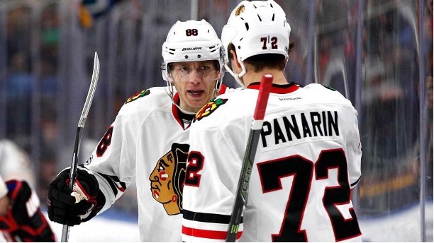 Patrick Kane (left) and former teammate Artemi Panarin (right) celebrating a goal. Kane and Panarin will be reunited in New York.