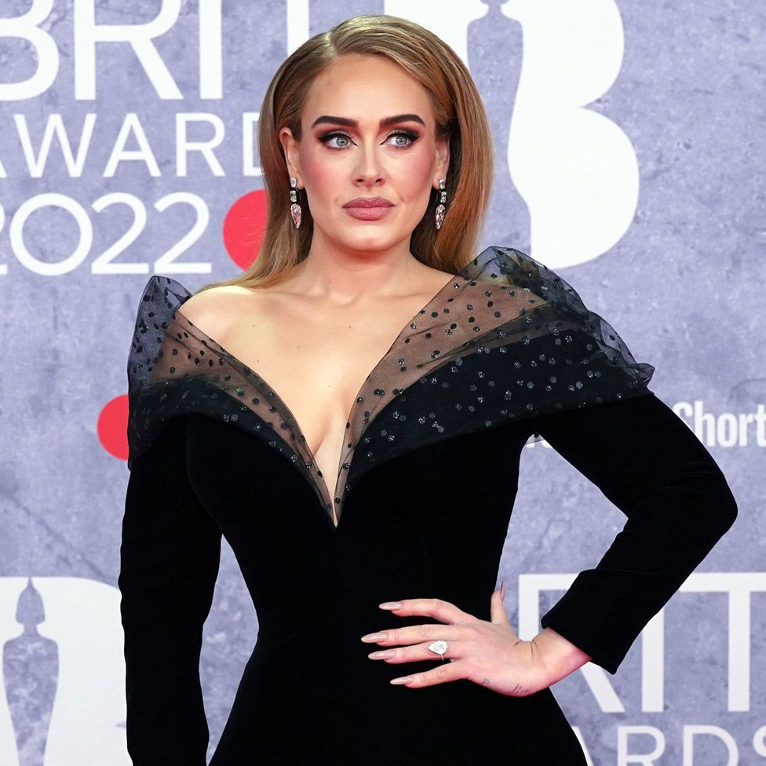 Adele posing at the Britain Awards on the red carpet. (Photo Creds: BBC News)