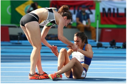 Abbey DAgostino from the United States (on the right) receives aid from Nikki Hamblin from New Zealand after a collision on the 11th day of the 2016 Olympic Games at the Olympic Stadium in Rio de Janeiro, Brazil.