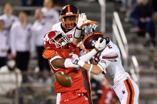 Marist receiver (red) drops pass in coverage by Brother Rice defenders (white) (photo via Kirsten Stickney)