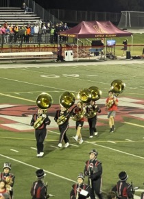 Marist tuba players doing a move called double time to their parade formation. 

