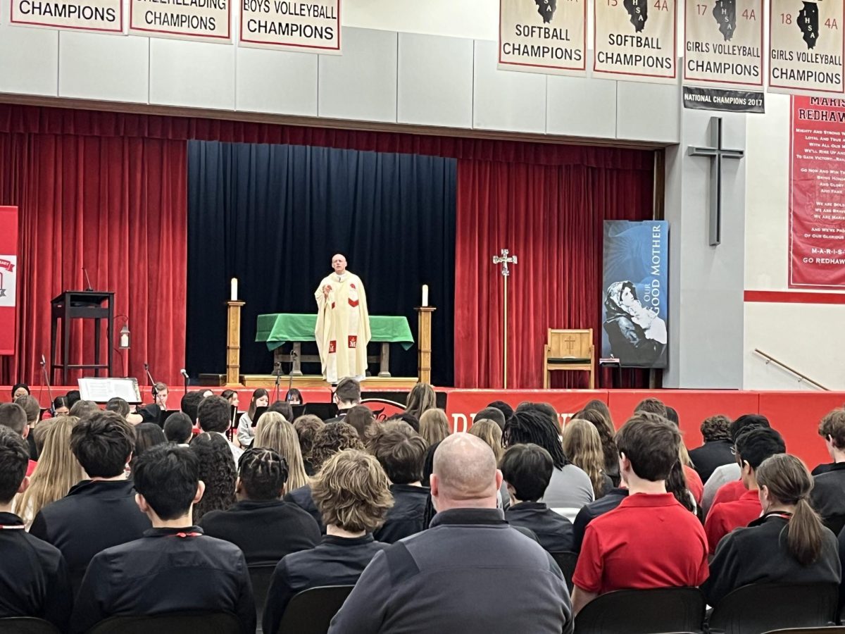 Father Tom Hurley leads an all school mass to kick off Catholic Schools week