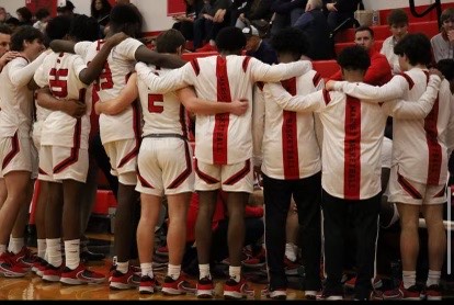 The Marist basketball team huddled together in this picture on their Instagram page