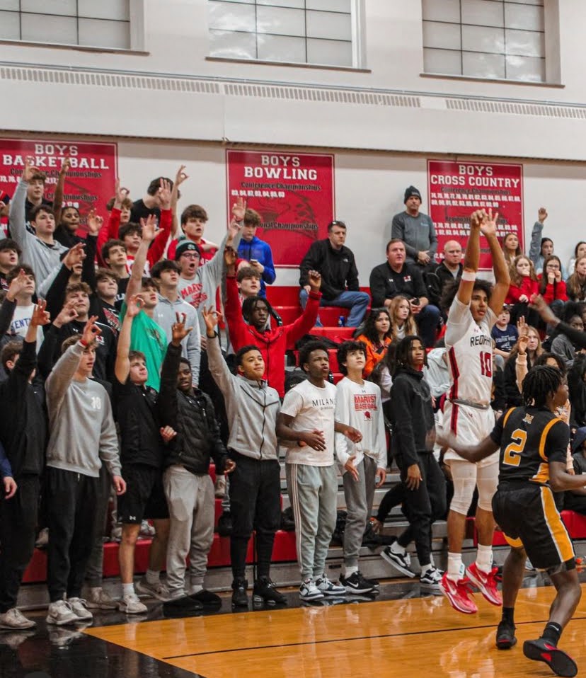 Marist student section cheering on boys basketball (Credit: Marist student Instagram)