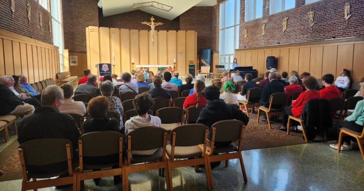 Marist students and grandparents gather in the Marist Chapel for Mass. (Credit: Marist High School Instagram)