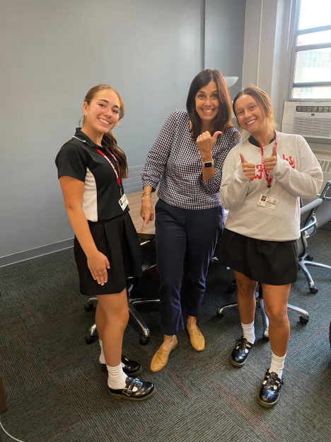 Juniors Ava Kruger and Aubrey Rowe display correct dress code with Mrs. Dunneback (Credit: Mike Philip) 