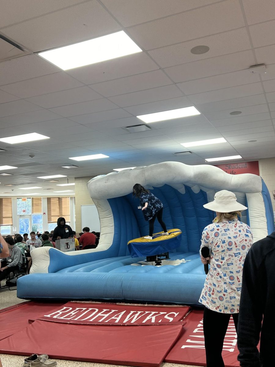 Sophomore Erin Trapani goes surfing in the cafeteria Wednesday