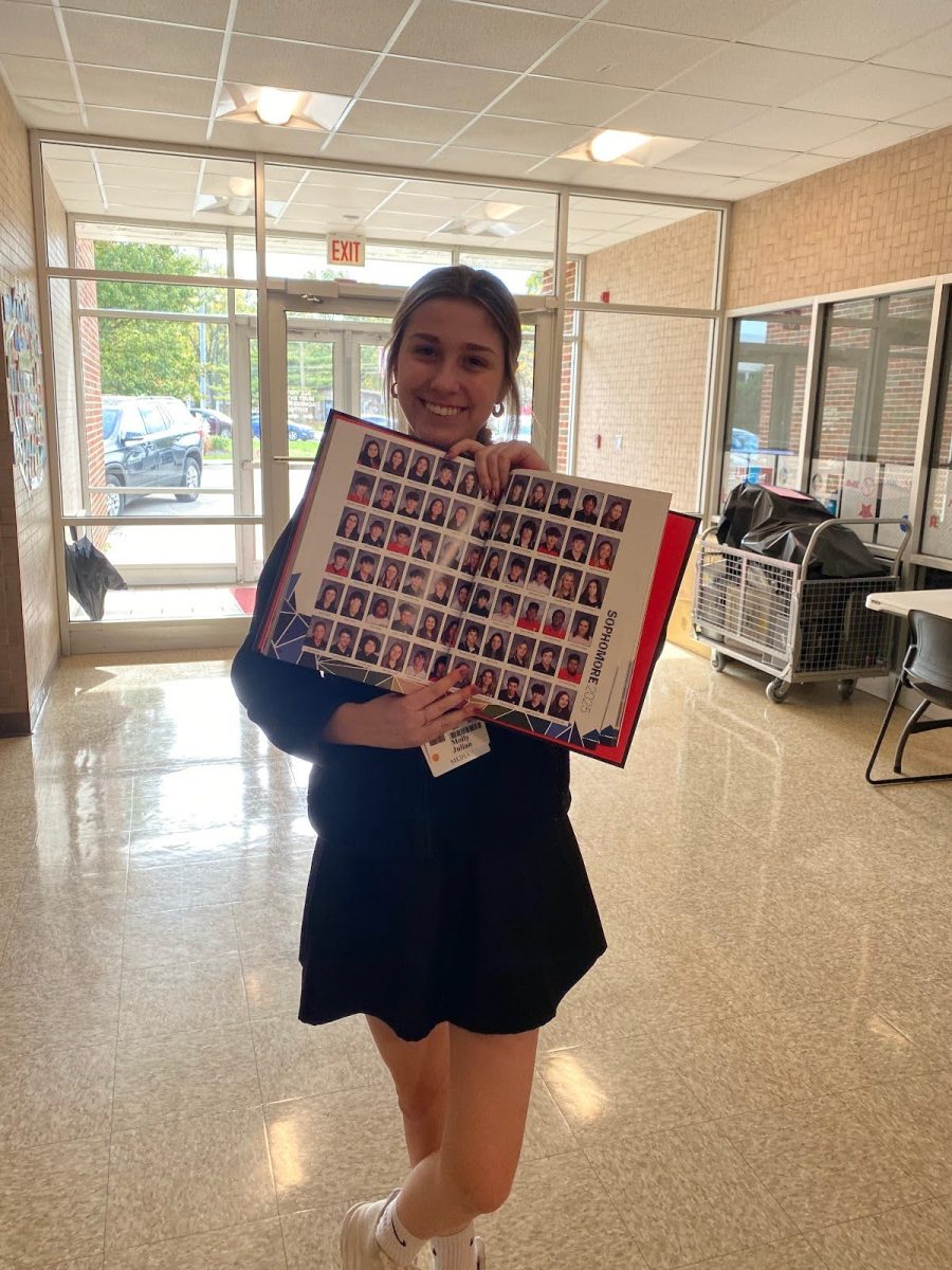 Junior Molly Julian displays an example of yearbook photos
