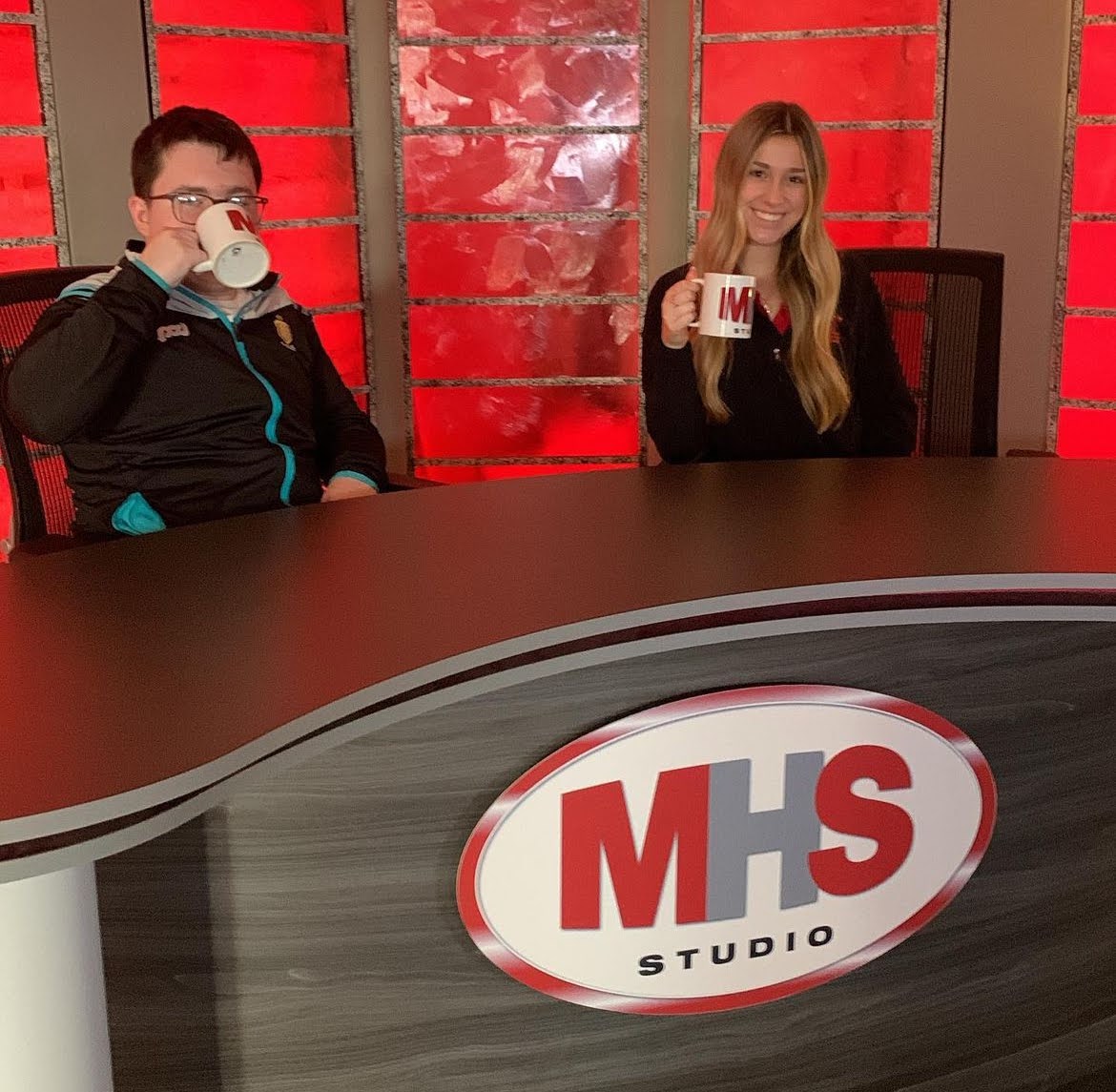 Ronan Carmody and Molly Julian, students in Broadcasting and Journalism, promoting the MHS studio during the open house