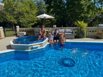 The Ivonova family and Mirarelli enjoy the cool summer day. (Photo Credit:  Kristina Ivonova)