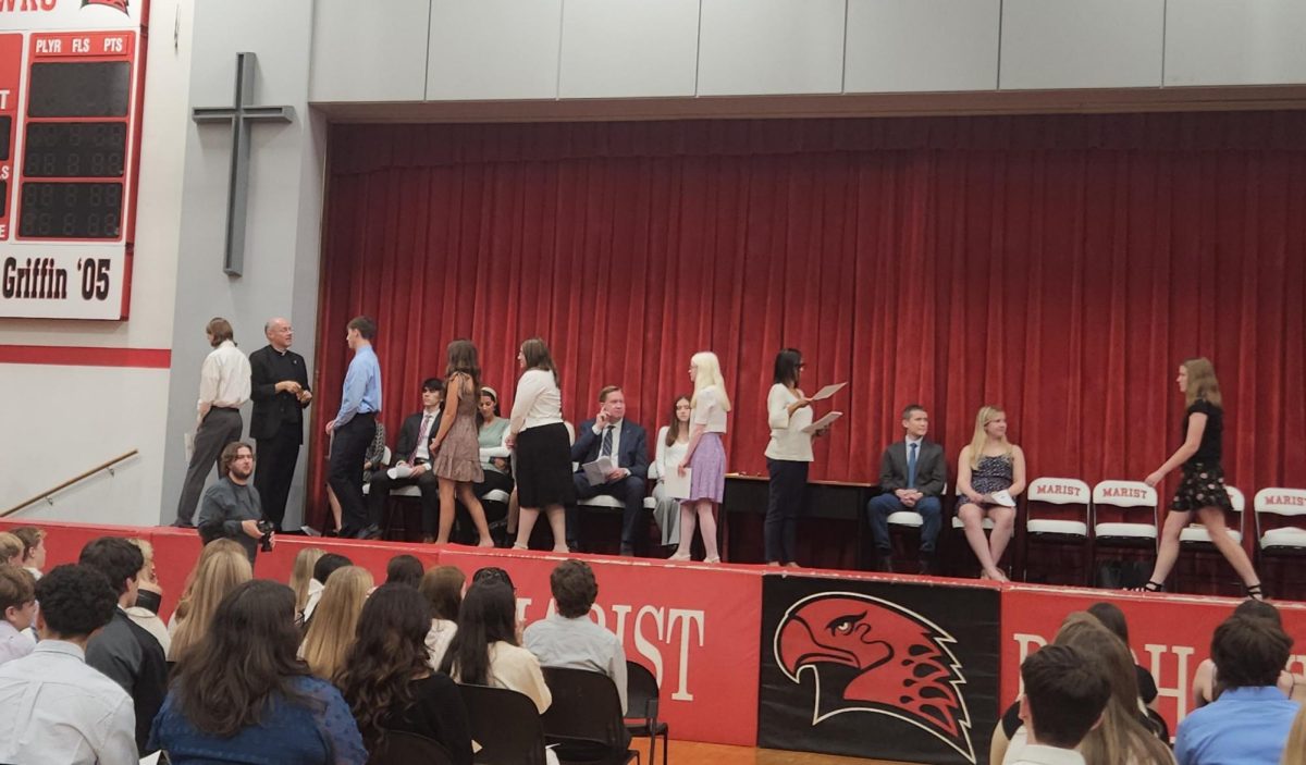 Students pictured awaiting for their NHS certificate and blessing from Fr. Hurley (Credit: George Kottaras)