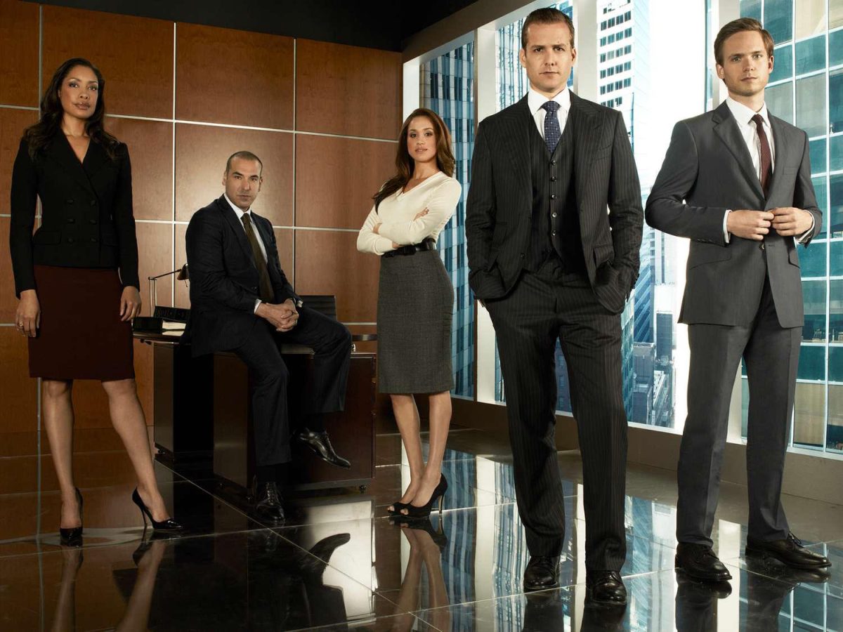 Some members of the cast of Suits pose for a promotional photo. (Credit: Frank Ockenfels/USA/NBCU)