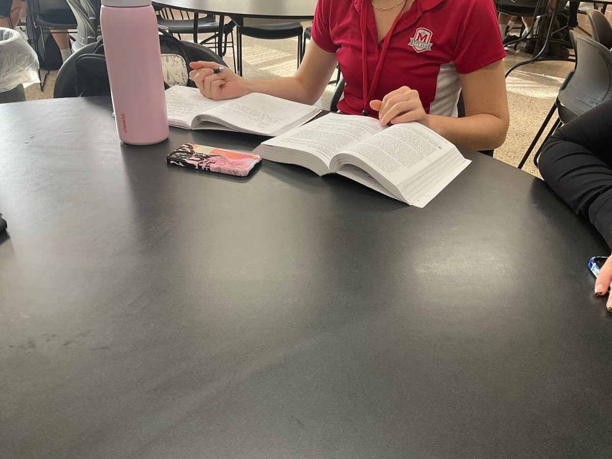 Junior Georgia Panos working on AP Lang during her lunch due to the lack of time she will have to finish after school