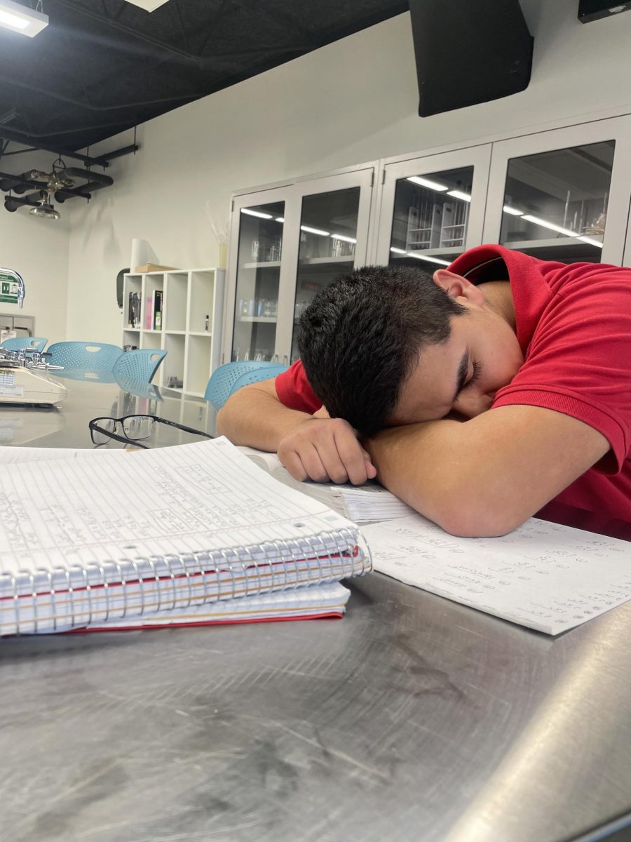 A Marist student pictured dozing off while attempting to finish his math homework