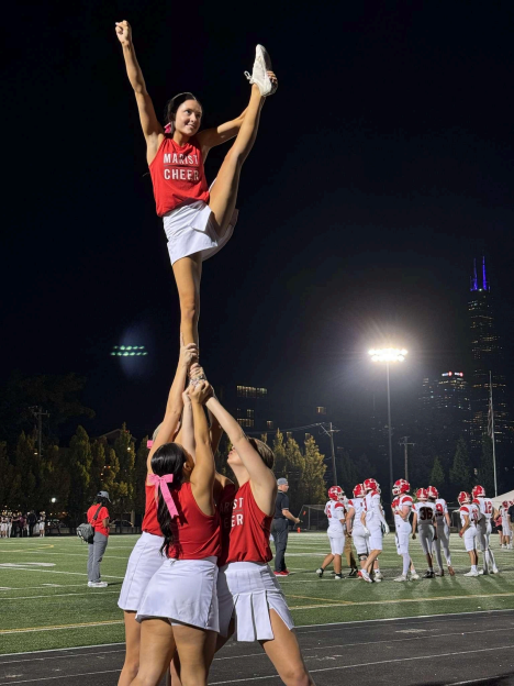 Athlete Mia Duszynski cheering for the Marist football team