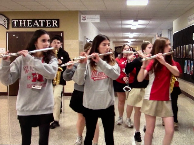 The band celebrating the cheer team