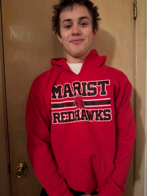 A student models a Marist hoodie