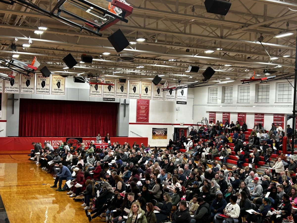 Incoming freshman parents gather in the main gym for the Freshman-Parent Night