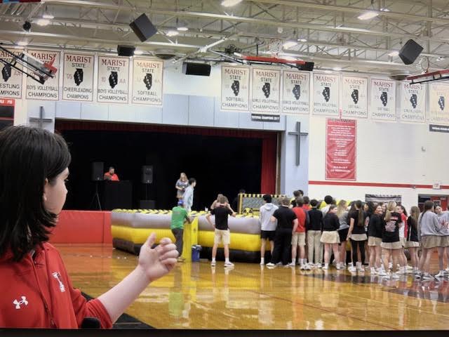 Kiefer Klug in the main gym showing off the obstacle course for Champagnat Day