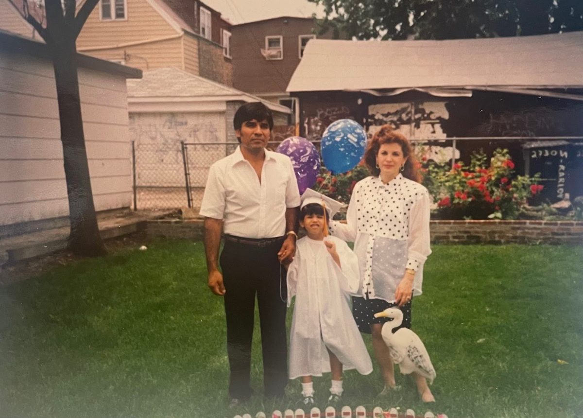 Macario Castellanos, Jennifer Castellanos, and Martha Castellanos (left to right) pictured in 1992 after Jennifer’s kindergarten graduation in their backyard