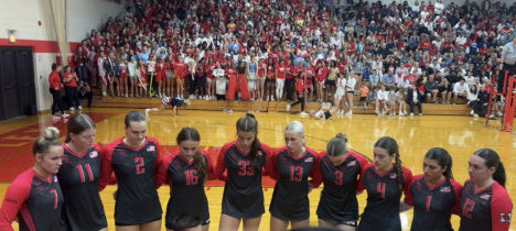 Marist girls volleyball team in a time-out during their game against Mother McAuley