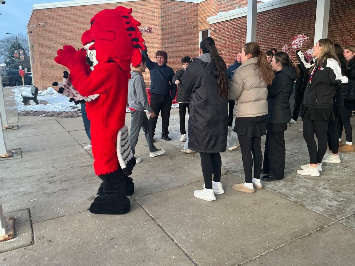 Marist students welcoming test-takers as they arrive