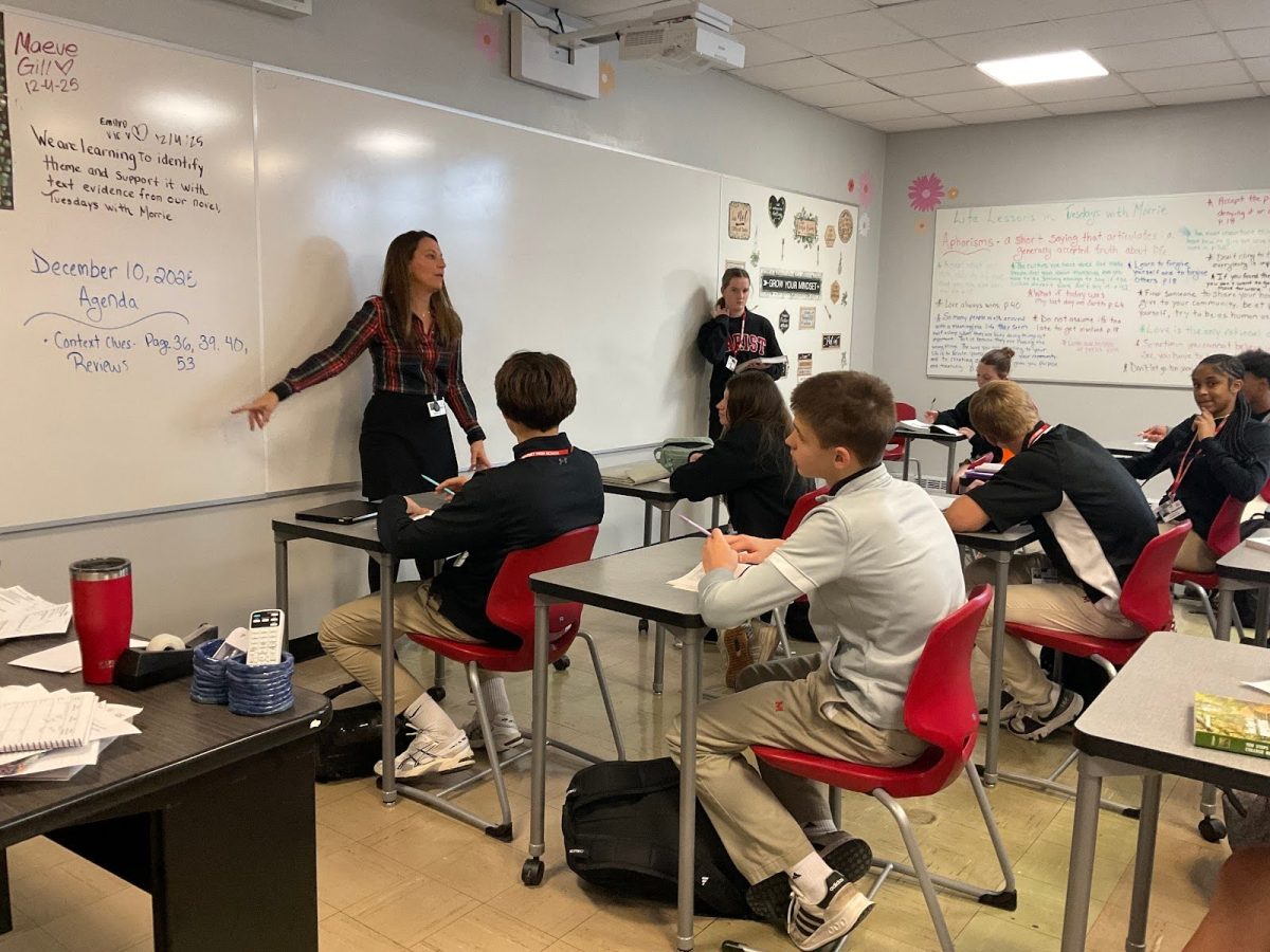 Mrs. McDonough giving her Marcellin college preparatory reading class instructions for the day