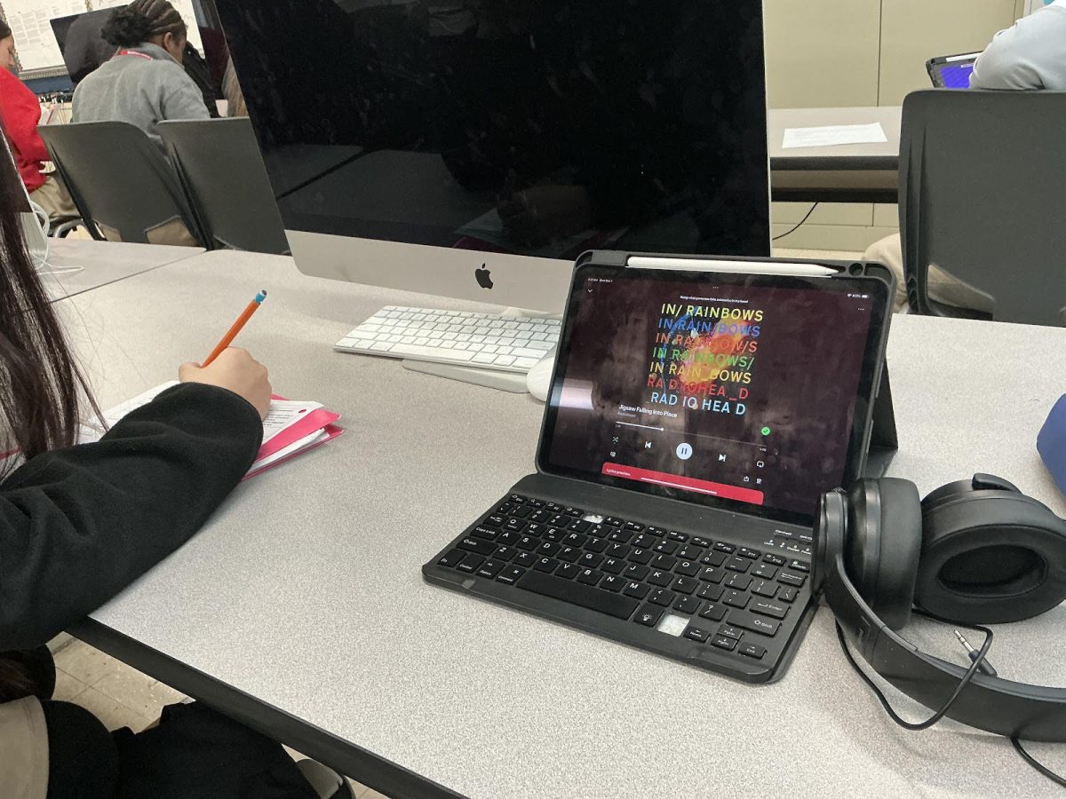 Students playing music while working in class