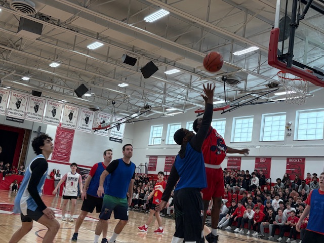 Teachers and seniors battle on the court Friday, January 30