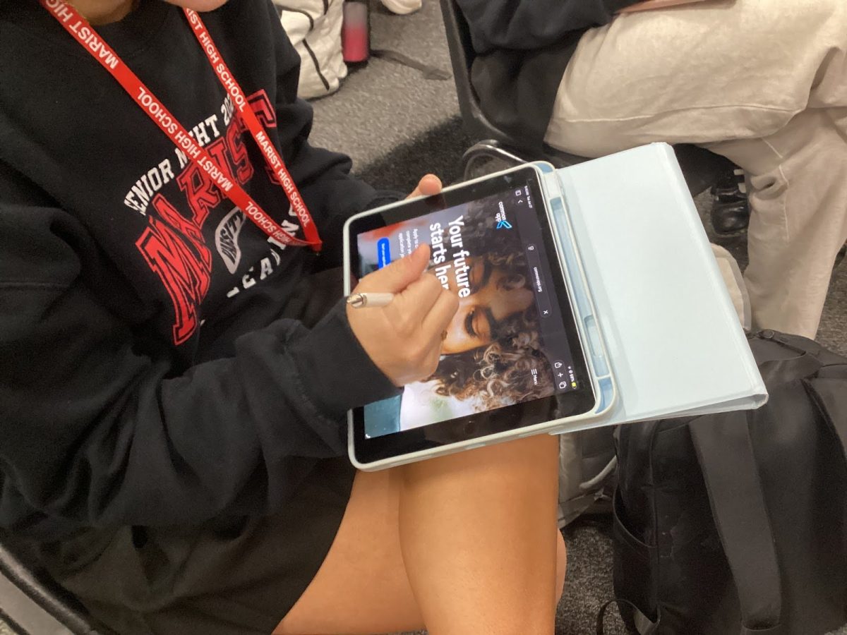 A senior checking her college applications through an application app
