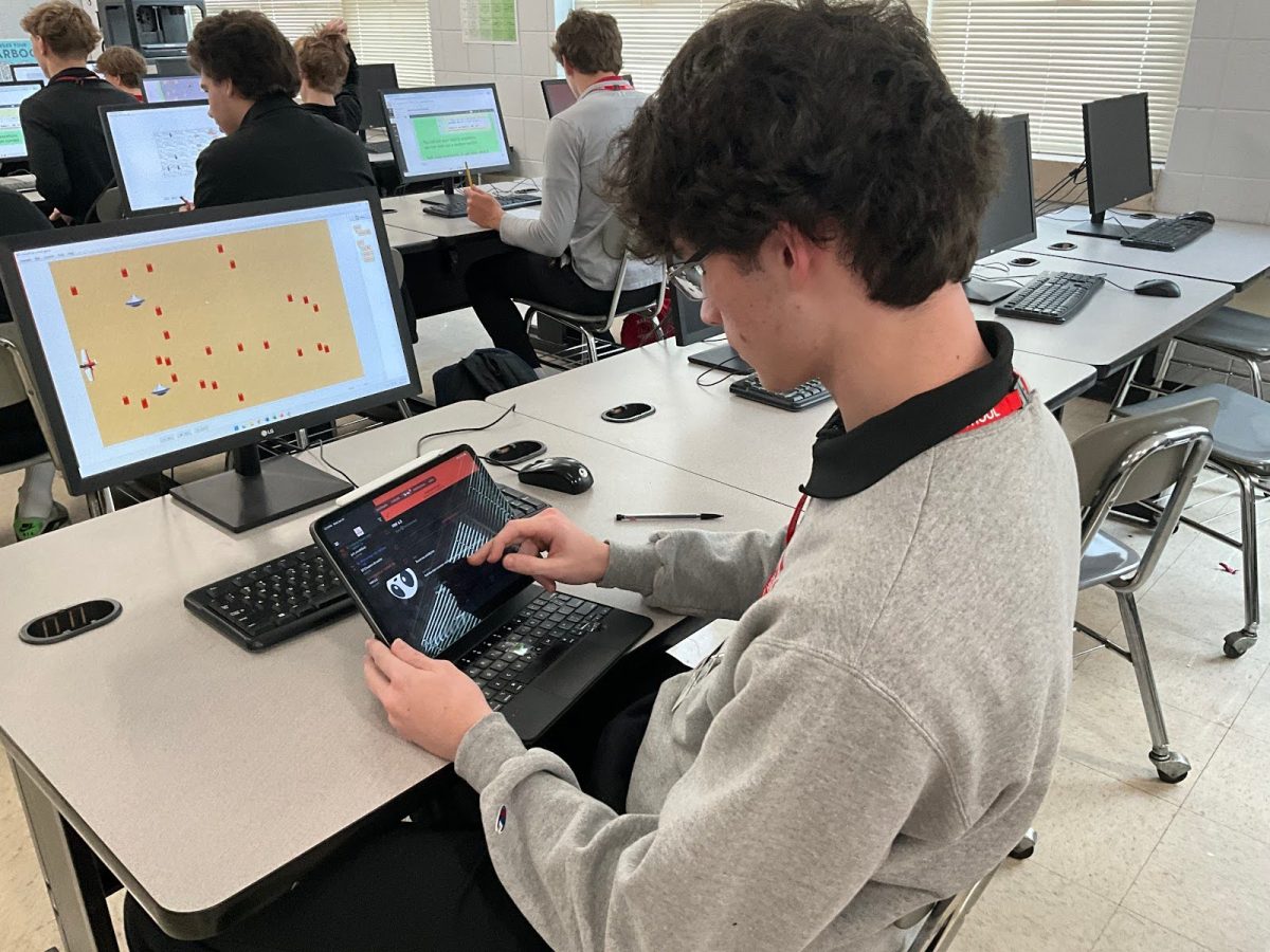 Marist student working on his iPad, using the Canvas app