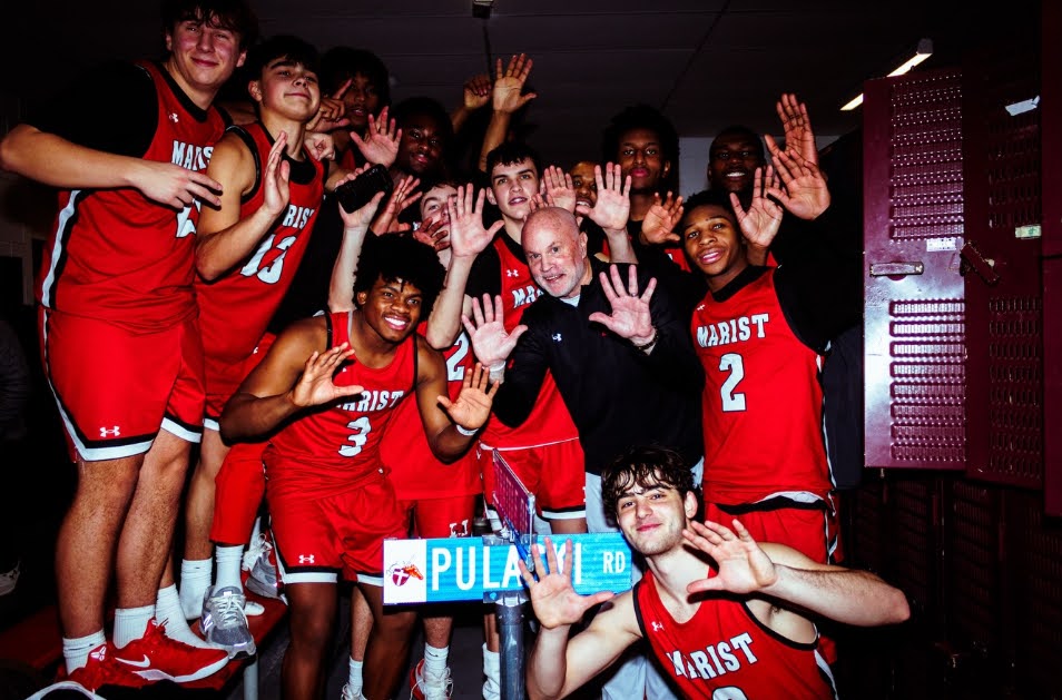 Members of the basketball team with Battle of Pulaski trophy after defeating archrival Brother Rice on January 20 (Credit: pork.visuals on Instagram)