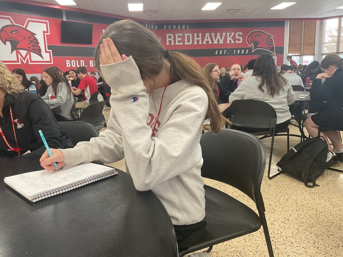 Junior Myranda Murdoch doing her homework at lunch