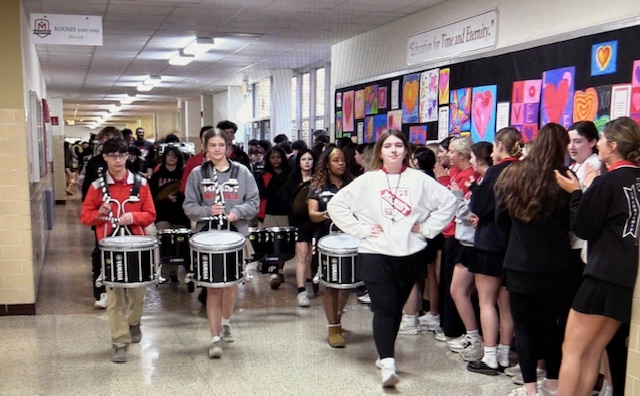The band sending off the final four-bound boys varsity basketball team Thursday, March 12