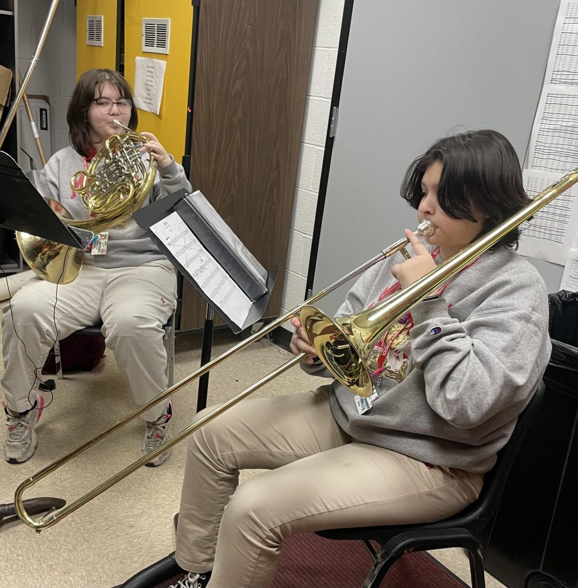 Band member Olive Bueno practicing with future band member Julliana Garcia 
