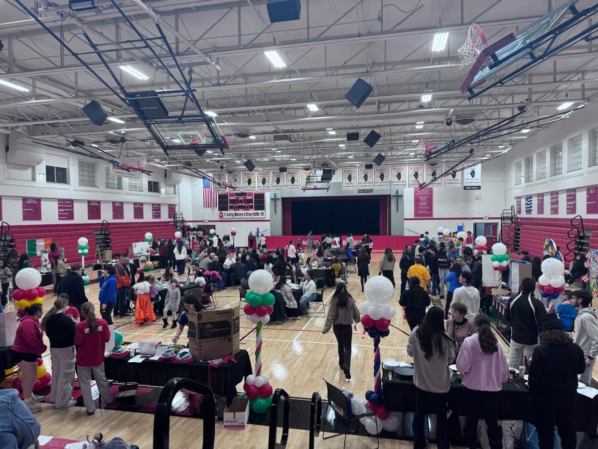 Guests walk around the main gym to learn about each culture