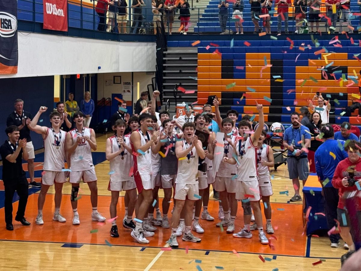 Members of the Marist boys volleyball team celebrating their state championship June 7, 2025