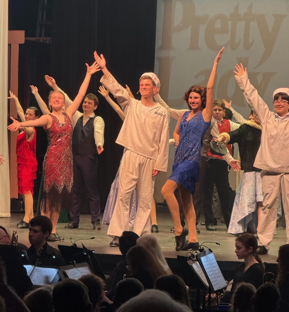 Spirits and arms high after students finished a successful run of "42nd Street"