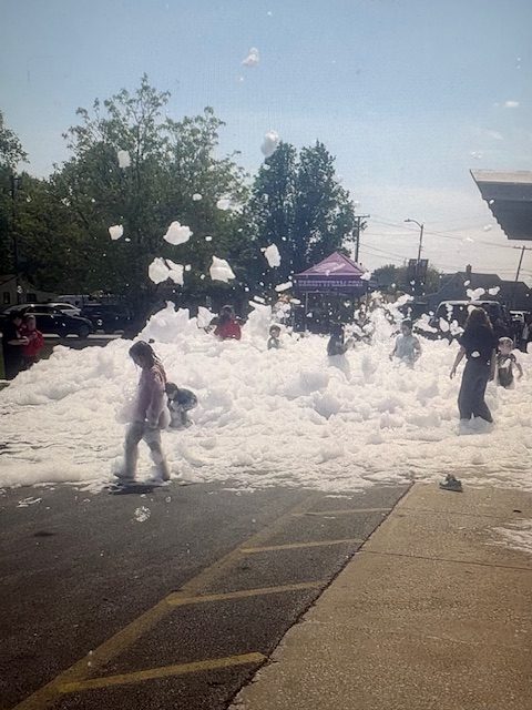 Kids enjoying the foam party at Marcellin's Marketplace