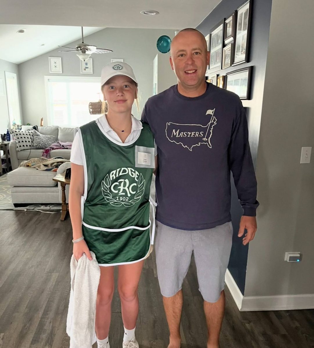 Marist student who works as a caddy during the school year and summer